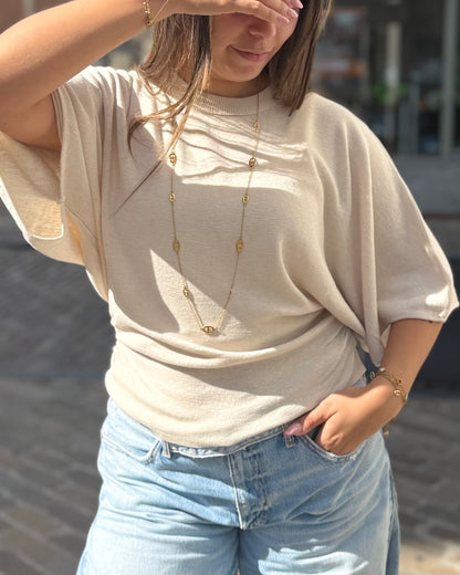 Pull cintré à la taille chauve souris beige